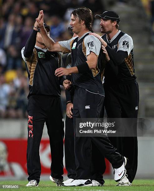 Shane Bond of New Zealand celebrates his wicket of David Warner of Australia during the Twenty20 international match between New Zealand and...