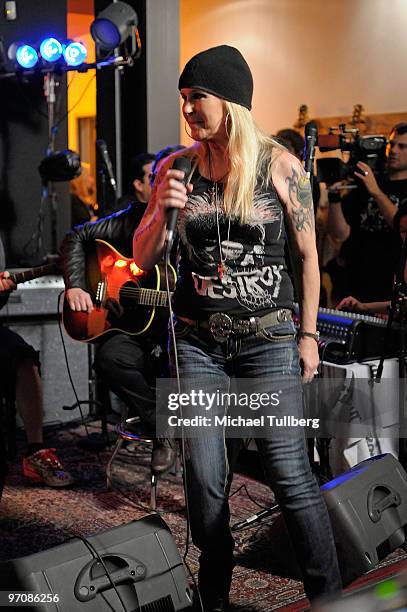 Singer/guitarist Lita Ford of The Runaways speaks onstage at the Rock 'N' Roll Fantasy Camp 2010 acoustic show, held at the Gibson Showroom on...