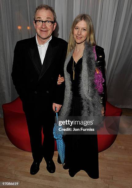 Harry Enfield and guest attends the Tim Burton's 'Alice In Wonderland' afterparty at the Sanderson Hotel on February 25, 2010 in London, England.