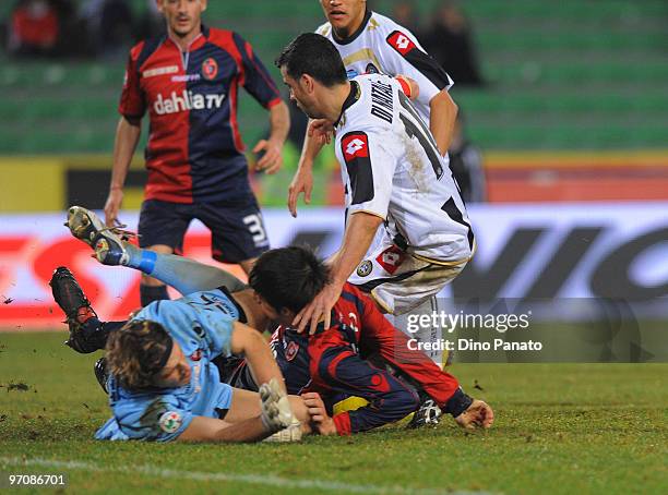 Goalkeeper of Cagliari Federico Marchetti and Antonio Di Natale of Udinese Lorenzo Ariaudo of Cagliari during the Serie A match between Udinese...