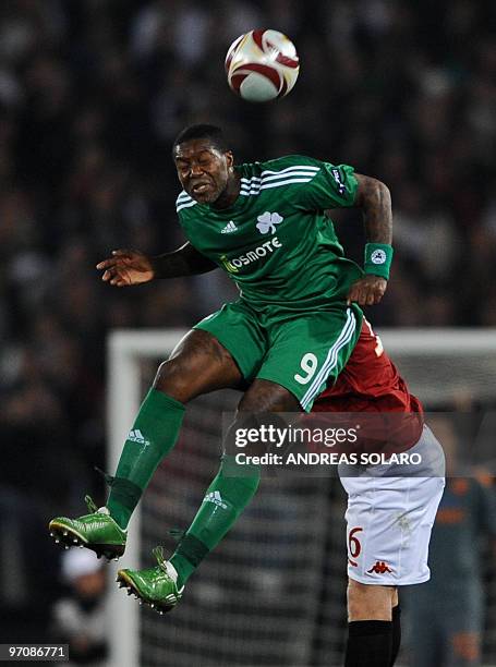 Panathinaikos French forward Djibril Cisse jumps for the ball during the football match against AS Roma at the UEFA Europa League event on February...