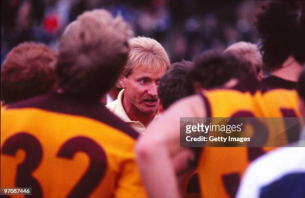 1980s: Brisbane Bears AFL coach Peter Knights addresses his players at quarter time during a AFL match in Melbourne, Australia.
