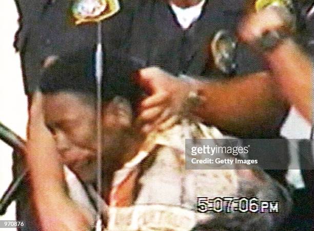 An Inglewood police officer punches 16-year-old Donovan Jackson on July 8, 2002 in Inglewood, California. Jackson was riding in a car with his father...
