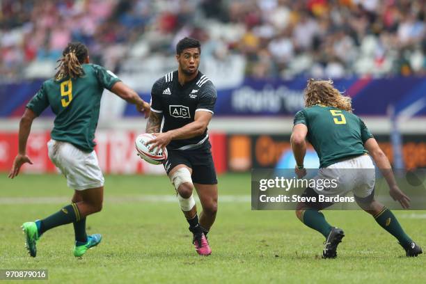 Regan Ware of New Zealand takes on the South Africa defence during the Cup semi final match between New Zealand and South Africa during the HSBC...
