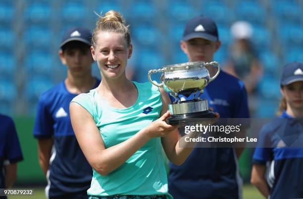 Alison Riske of USA poses for the camera with the Surbition Trophy after her victory over Conny Perrin of Switzerland during their Womens Final match...