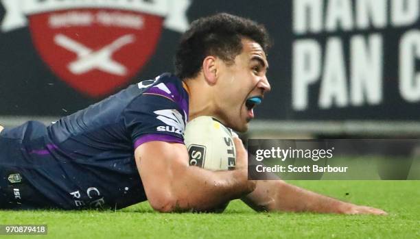 Jahrome Hughes of the Melbourne Storm scores a try during the round 14 NRL match between the Melbourne Storm and the Brisbane Broncos at AAMI Park on...