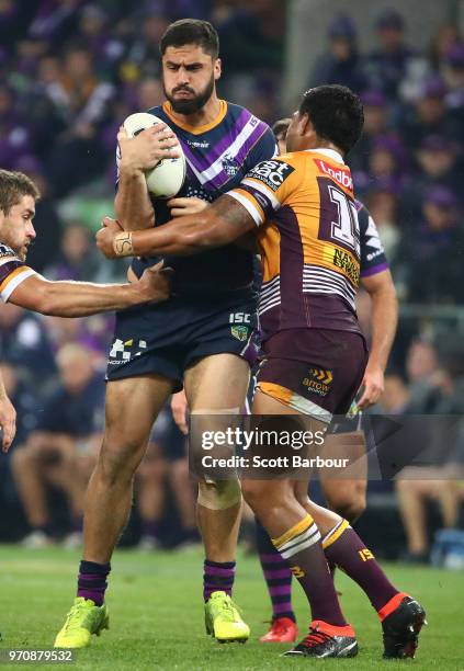 Jesse Bromwich of the Melbourne Storm runs with the ball during the round 14 NRL match between the Melbourne Storm and the Brisbane Broncos at AAMI...