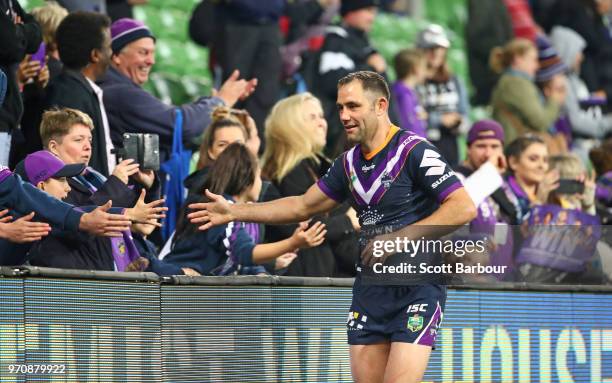 Cameron Smith of the Melbourne Storm celebrates with supporters in the crowd after winning the round 14 NRL match between the Melbourne Storm and the...