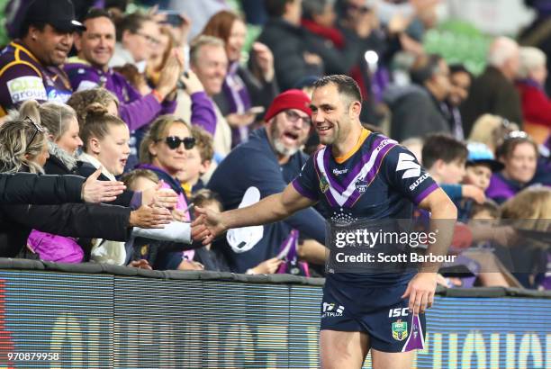 Cameron Smith of the Melbourne Storm celebrates with supporters in the crowd after winning the round 14 NRL match between the Melbourne Storm and the...