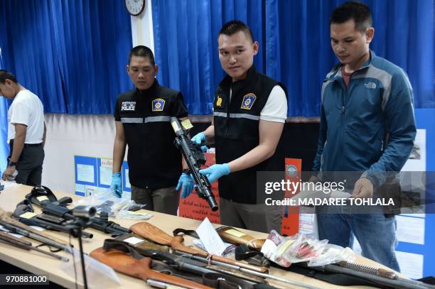 Royal Thai police display a cache of seized weapons and ammunition during a press conference in the southern province of Narathiwat on June 10, 2018.
