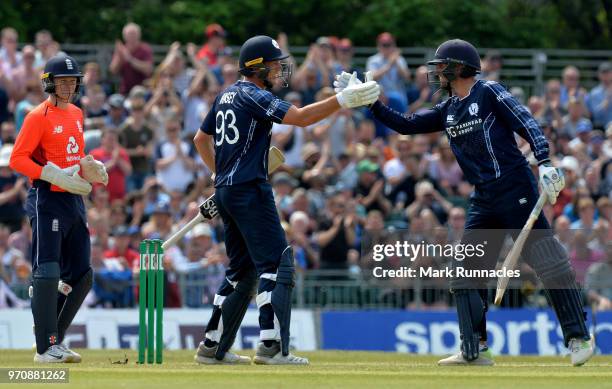 George Munsey , of Scotland and team mate Callum MacLeod reach a 100 partnership during the One Day International match between Scotland and England...