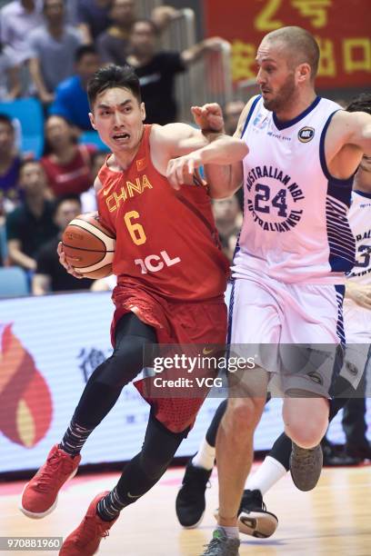 Zhao Tailong of China and Jesse Wagstaff of Australia vie during 2018 China Australia International Men's Basketball Match between Chinese National...