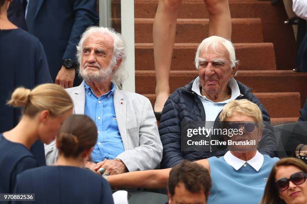 French actors Jean-Paul Belmondo and Charles Gerard look on ahead of the mens singles final between Rafael Nadal of Spain and Dominic Thiem of...