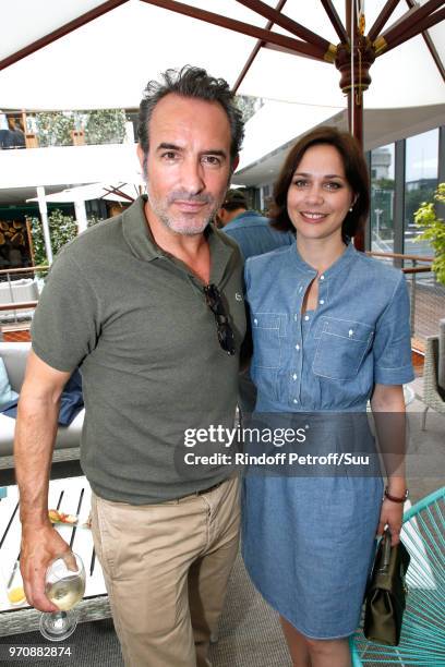 Jean Dujardin and Nathalie Pechalat attend the Men Final of the 2018 French Open - Day Fithteen at Roland Garros on June 10, 2018 in Paris, France.