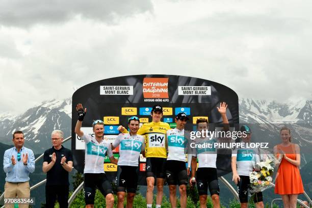 Overall race winner Britain's Geraint Thomas , wearing the overall leader's yellow jersey, and his Great Britain's Sky cycling team Netherlands'...