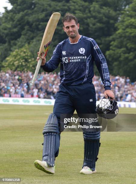 Calum MacLeod of Scotland leaves the field 140 not out during the One-Day International match between Scotland and England at Grange cricket club...