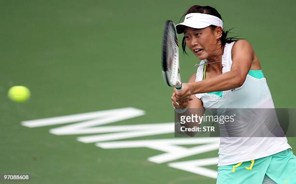 Kai Chen Chang of Taiwan hits a return to Sybille Bammer of Australia during their quarter-final match of the WTA Malaysian Open 2010 Tennis...