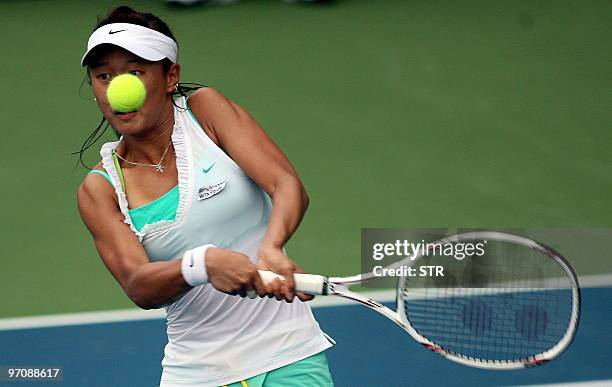 Kai Chen Chang of Taiwan hits a return to Sybille Bammer of Australia during their quarter-final match of the WTA Malaysian Open 2010 Tennis...