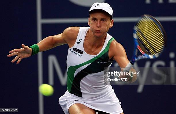 Sybille Bammer of Australia hits a return to Kai Chen Chang of Taiwan during their quarter-final match of the WTA Malaysian Open 2010 Tennis...