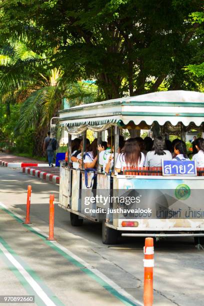 shuttle bus with thai students - university shuttle bus stock pictures, royalty-free photos & images