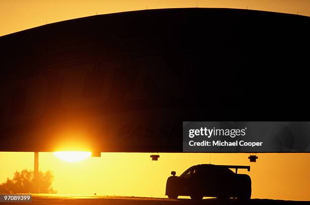 McLaren F1 GTR greets the sunrise under the Dunlop Bridge during the 24 Hours of Le Mans race on 16th June 1996 at the Circuit de la Sarthe, Le Mans,...