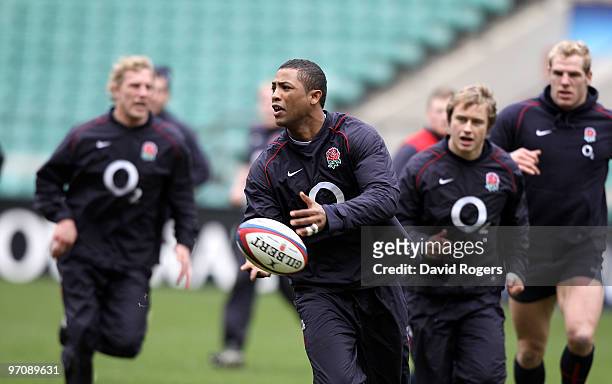 Delon Armitage runs with the ball during the England training session held at Twickenham Stadium on February 26, 2010 in London, England.