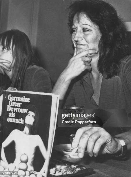 Australian feminist writer Germaine Greer with a Dutch edition of her best-known book, 'The Female Eunuch', 13th June 1972.