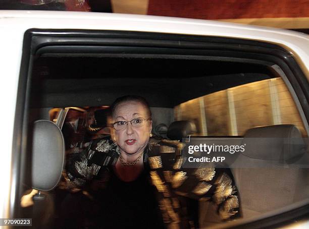 Dominican Julieta Trujillo, niece of late Dominican Republic dictator Rafael Trujillo, leaves a hotel in Santo Domingo escorted by police officers on...