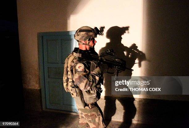 French soldier of the 21st RIMA secures the French-British base after a RPG attack during the night, in Showal, Southern Afghanistan, in the Helmand...