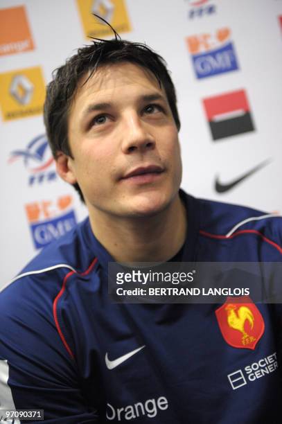 French rugby national team's fly-half Francois Trinh-Duc answers journalists' questions during a press conference at the team's training centre in...