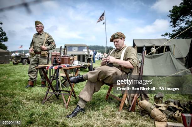 Man dressed in a WWII uniform fills a rifle magazine with ammunition at the Dig for Victory Show, a festival that celebrates the 1940's, at the North...