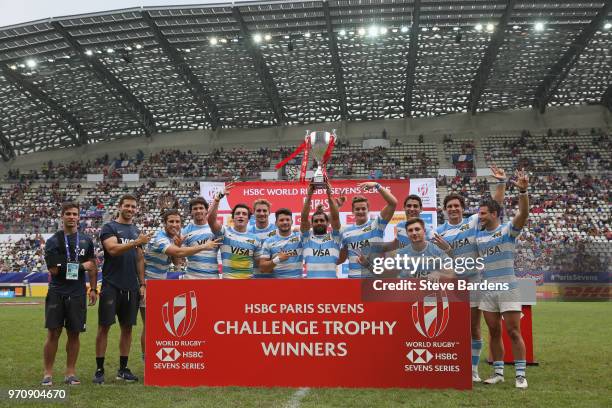 The Argentina players celebrate with the trophy after their victory over Wales after the trophy Final between Argentina and Wales during the HSBC...