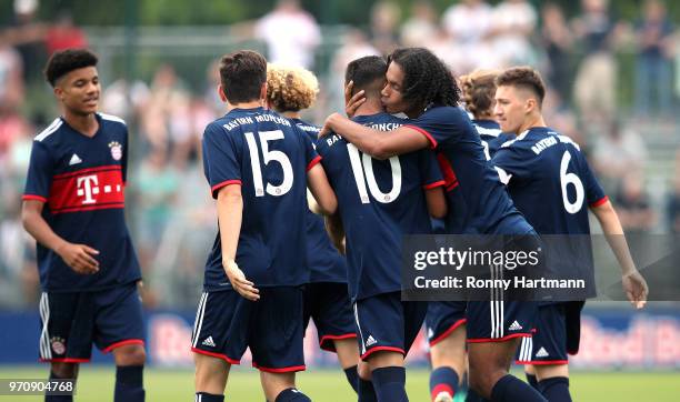 Oliver Batista Meier of FC Bayern Muenchen U17 celebrates after scoring his team's opening goal with Yannick Brugger of FC Bayern Muenchen U17 during...