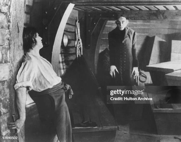 On board the Demeter, the vampire Count Orlok, played by German actor Max Schreck , emerges from one of his coffins before they can be destroyed by...