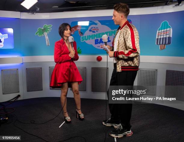 Camila Cabello and Roman Kemp in the on air studio during Capital's Summertime Ball with Vodafone at Wembley Stadium, London. PRESS ASSOCIATION...