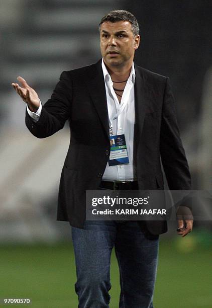 Qatar's Al-Sadd club head coach Aurelian Cosmin Olaroiu of Romania attends his team's AFC Champions League match against Saudi Al-Hilal club in Doha...