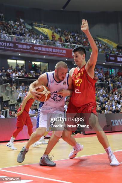Jesse Wagstaff of Australia drives to the basket against Abudou of China during the 2018 Sino-Australian Men's Internationl Basketball Challenge...