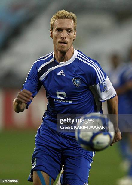 Saudi Al-Hilal club player Christian Wilhelmsson of Sweden runs with the ball during his team's AFC Champions League match against Qatar's Al-Sadd...