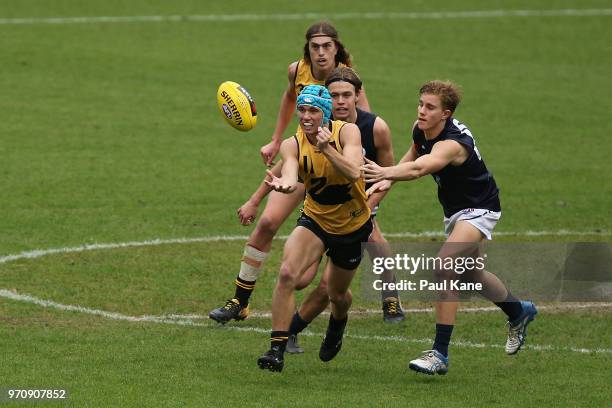 Luke English of WA handballs during the 2018 NAB AFL Under-18 Championships match between Western Australia and Vic Metro at Optus Stadium on June...