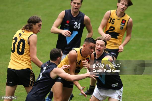 Regan Spooner of WA handballs during the 2018 NAB AFL Under-18 Championships match between Western Australia and Vic Metro at Optus Stadium on June...