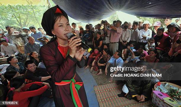 Quan ho" singer performs at the Hoi Lim festival, popular for its Quan Ho folk music, in the northern province of Bac Ninh on February 26, 2010. Quan...