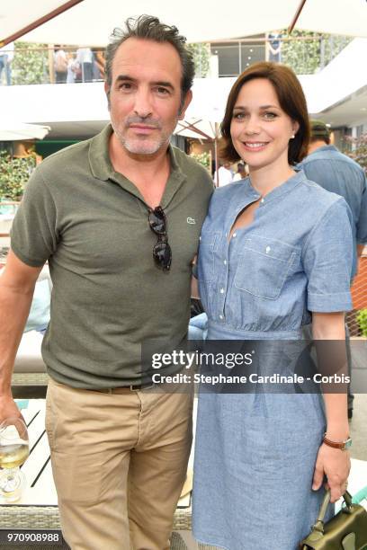 Actor Jean Dujardin and his wife Nathalie Pechalat attend the Men Final of the 2018 French Open - Day Fifteen at Roland Garros on June 10, 2018 in...