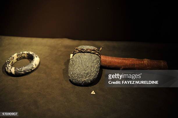 Tools and a bracelet sit in a display case at a museum in Tamanrasset on February 24, 2010. AFP PHOTO / FAYEZ NURELDINE