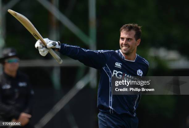 Calum MacLeod of Scotland celebrates reaching his century during the One-Day International match between Scotland and England at Grange cricket club...