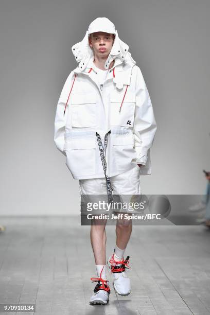 Model walks the runway at the Christopher Raeburn show during London Fashion Week Men's June 2018 BFC Show Space on June 10, 2018 in London, England.