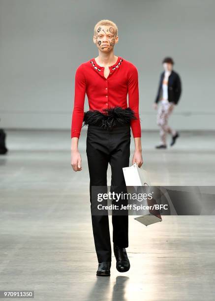 Model walks the runway at the Stefan Cooke show as part of the MAN show during London Fashion Week Men's June 2018 on June 10, 2018 at the Old Truman...