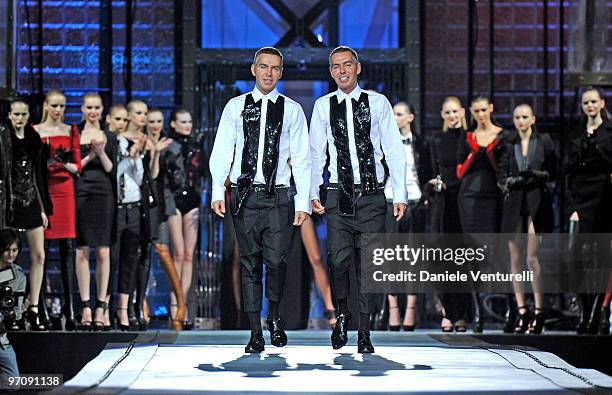 Dean Caten and Dan Caten aknowledge the applause of the public after the DSquared2 Milan Fashion Week Autumn/Winter 2010 show on February 26, 2010 in...