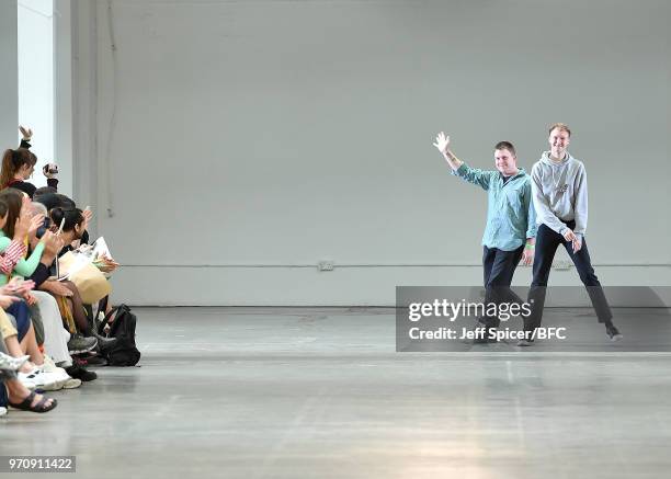 Jake Burt and Stefan Cooke walk the runway at the Stefan Cooke show as part of the MAN show during London Fashion Week Men's June 2018 on June 10,...