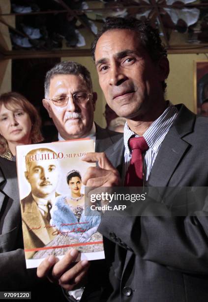 Amable Trujillo great nephew of late Dominican Republic dictator Rafael Trujillo, shows a book written by Angelita Trujillo, daughter of the...