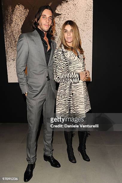 Vladimir Restoin Roitfeld and Carine Roitfeld attend Richard Hambleton Exhibition during Milan Fashion Week Womenswear Autumn/Winter 2010 show on...